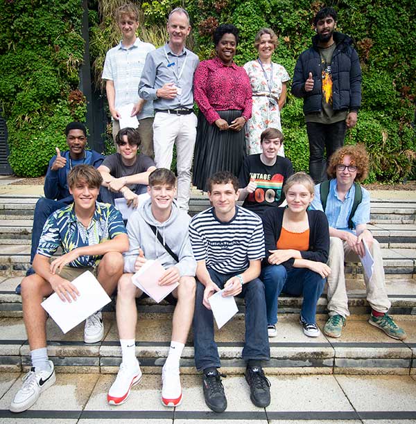 Acland Burghley School students celebrate A-level results outside the LaSWAP Sixth Form block.